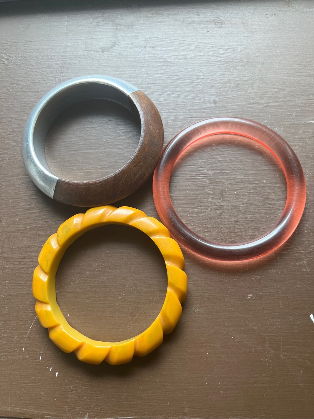Lot of vintage bangles wood metal and resin? Celluloid? Bakelite ?